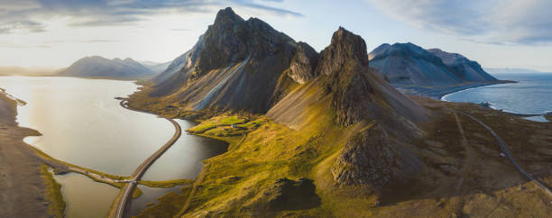 scenic road in Iceland, beautiful nature landscape aerial panorama of mountains scenic road in Iceland, beautiful nature landscape aerial panorama, mountains and coast at sunset iceland stock pictures, royalty-free photos & images