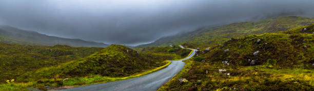 Scenic Single Track Road Through Hills On Isle Of Skye In Scotland stock photo