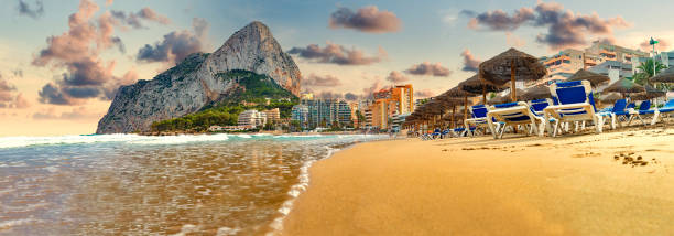 Scenic Spain beach sunset Rock of Penon by Ifach. Mediterranean coast landscape in the city of Calpe. Coastal city located in the Valencian Community, Alicante, Spain. calpe stock pictures, royalty-free photos & images