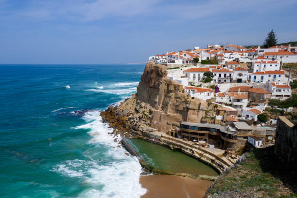 Scenic view of Azenhas do Mar, a small coast town in Colares, Sintra, Lisbon. Village, waves, sea and a pool. stock photo
