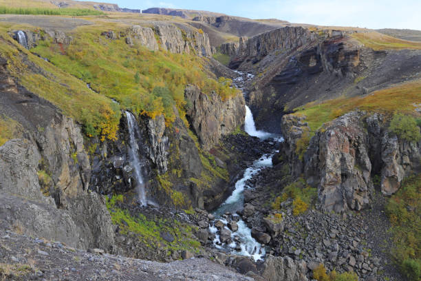 Scenic view of Hengifossargljufur gorge in Fljotsdalur valley in East Iceland. stock photo