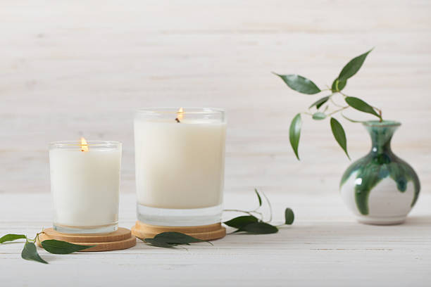 scented candles on white background - kokulu stok fotoğraflar ve resimler