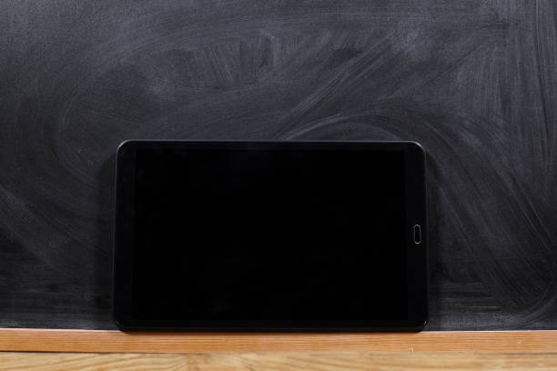 school blackboard and tablet as a background. stock photo