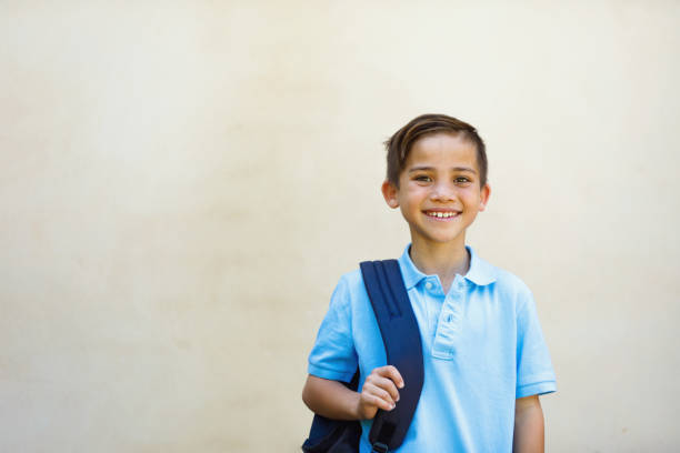 School Boy Young School Boy with backpack before going to school elementary student stock pictures, royalty-free photos & images