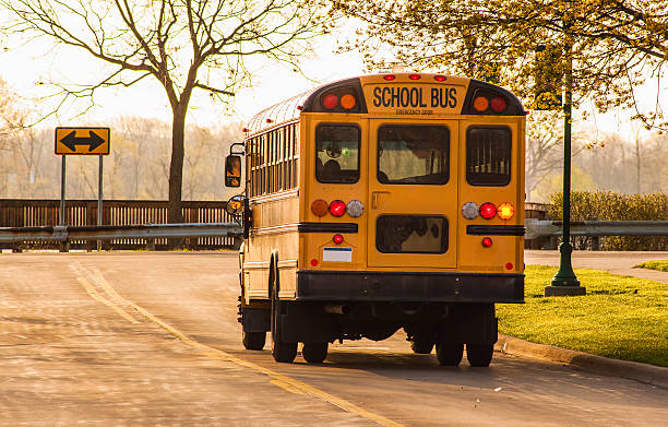 School Buses School bus in route to collect students school buses stock pictures, royalty-free photos & images