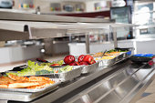 School cafeteria line with healthy and unhealthy food choices