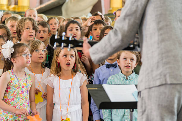 School children singing in the church. stock photo