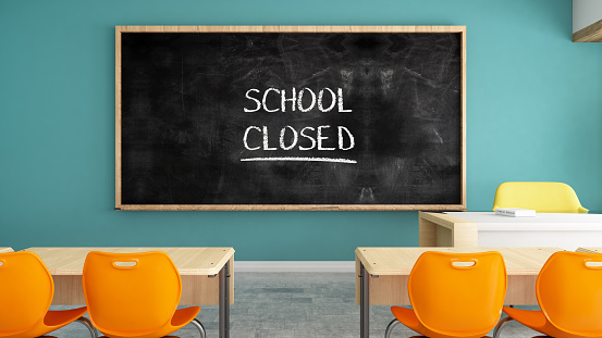 School Closed Sign on Chalkboard in Classroom. 3d Render