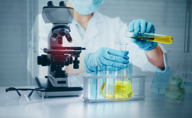 Science Oil Chemistry Expertise is Experiment Analysis With Microscope Equipment in Laboratory. Double Exposure of Scientist Chemical Research Testing and Study Oil Lubricant in Lab. Oil Industry stock photo