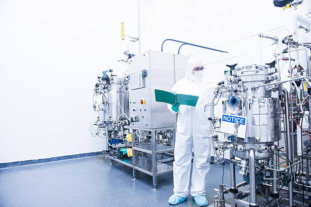 scientist with bioreactor stock photo