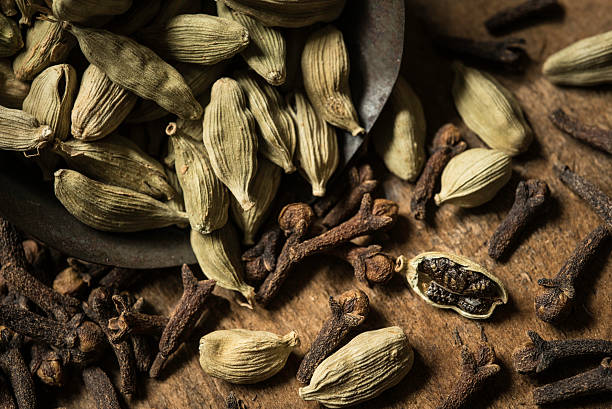 Scoop of Cardamom and Cloves stock photo