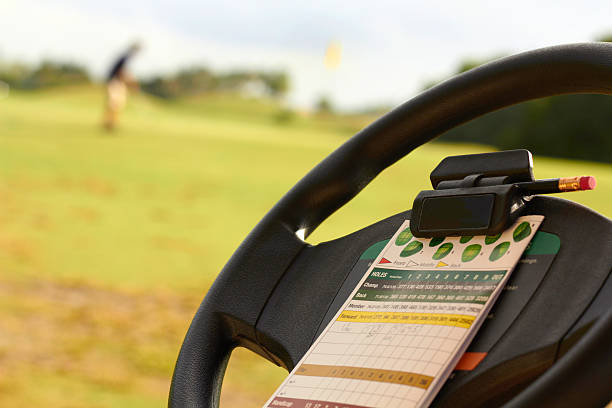 Score Card On Steering Wheel Of Golf Cart stock photo