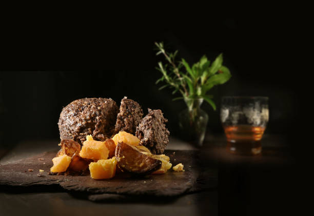 Scottish Haggis, Neeps, Tatties and Whisky Traditional Scottish Haggis, Neeps, Tatties and Whisky shot against a dark rustic background with generous accommodation for copy space. liver offal photos stock pictures, royalty-free photos & images