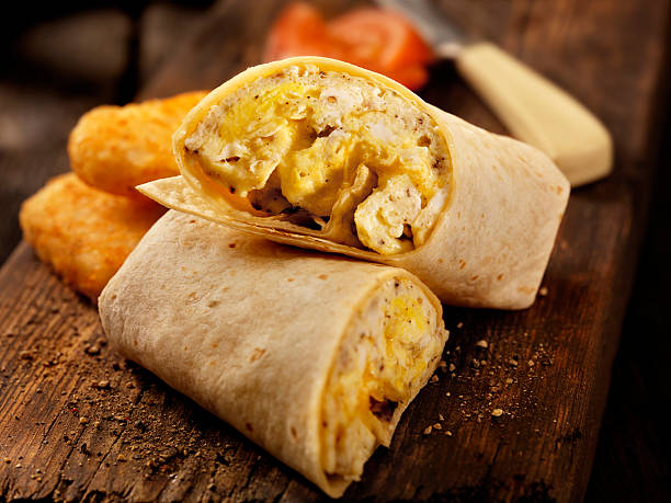 Scrambled Egg and Cheese Breakfast Wrap Scrambled Egg and Cheese Breakfast Wrap -Photographed on Hasselblad H3D2-39mb Camera hash brown photos stock pictures, royalty-free photos & images