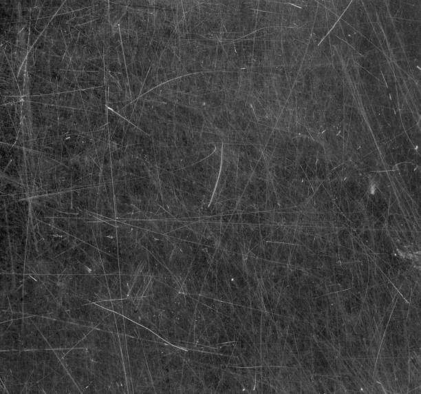 Scratched glass surface. Black and white stock photo
