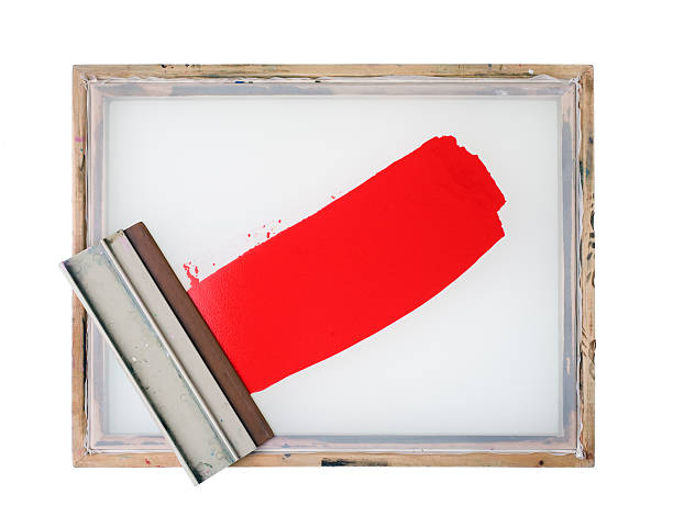 Screen printing frame with red paint (isolated) stock photo