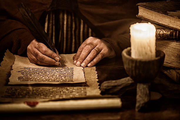 Scribe writing Scribe writing old document medieval stock pictures, royalty-free photos & images