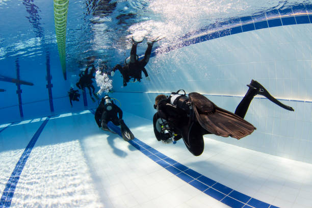 Scuba Divers Swimming Scuba divers swimming and training aqualung diving equipment photos stock pictures, royalty-free photos & images