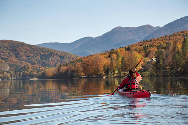 Sea kayaking on a calm lake stock photo