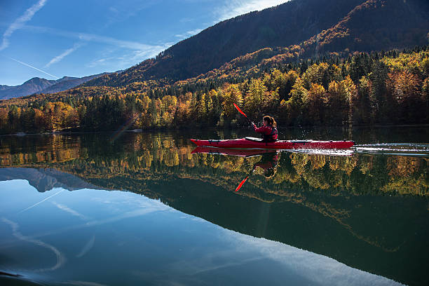 Sea kayaking on a calm lake stock photo