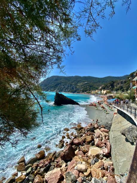 sea stacks and sunbathers at bagno eden beach, monterosso al mare, la spezia, italy. trekking through the cinque terre, italy - august 2021 samuel howell stock pictures, royalty-free photos & images