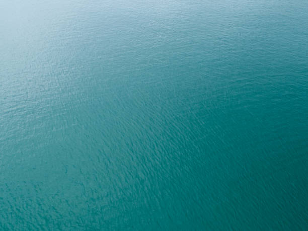 Sea surface aerial view,Bird eye view photo of small waves and water surface texture Turquoise sea background Beautiful nature Amazing view stock photo