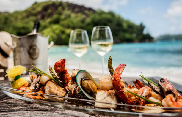 Seafood Lunch on the beach Lunch on the beach of Seychelles fine dining stock pictures, royalty-free photos & images
