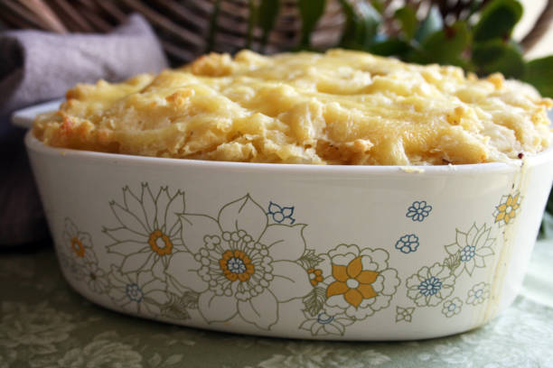Seafood Pie - Fish Pie - Retro Food Homestyle seafood pie with a potato and melted cheese topping. Picture could also pass for a shepherd's pie as well. casserole dish stock pictures, royalty-free photos & images