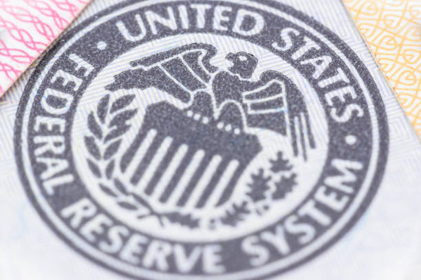 Seal of the Federal Reserve System, currency concept. Closeup image : Seal of the Federal Reserve System, currency concept. FED or the Federal Reserve System is central banking system of United States of America, control and alleviate financial crises. federal reserve stock pictures, royalty-free photos & images