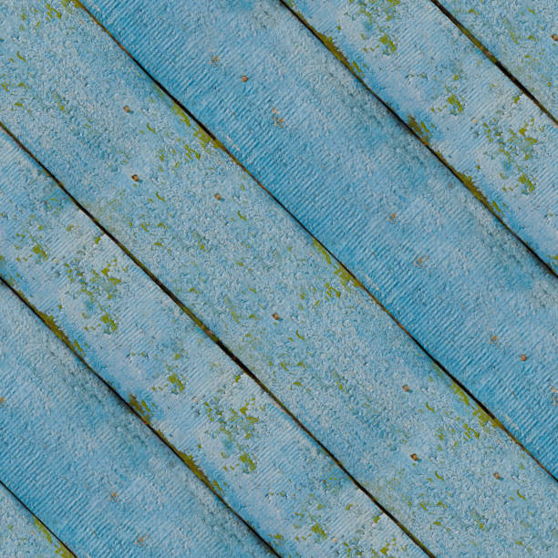 Seamless pattern of blue wooden planks wall with corrosion Seamless pattern of old blue wooden plank wall or pavement for design and matte painting xylo stock pictures, royalty-free photos & images