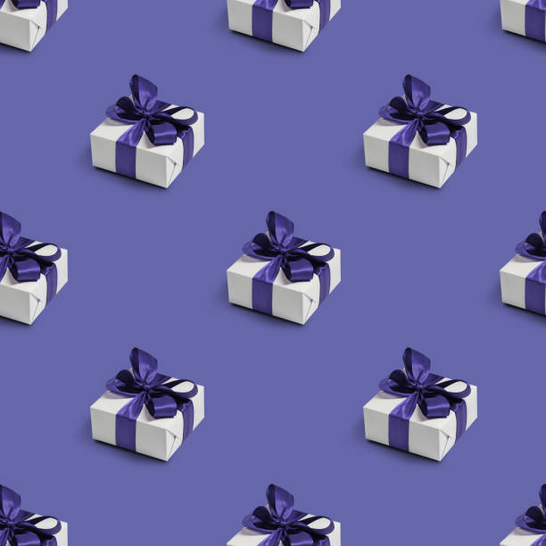 Seamless pattern with cute gifts on purple background. Color of the year 2022 Very Peri. stock photo