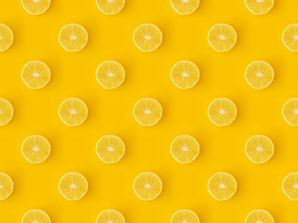 Seamless repetitive Lemon slice pattern on yellow background stock photo