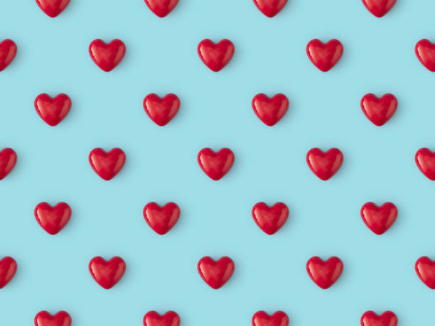 Seamless repetitive Red Heart Shape on blue background stock photo