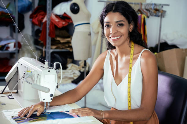 Seamstress Working on Sewing Machine stock photo