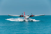 istock Seaplane landing in Maldives lagoon 1216952723