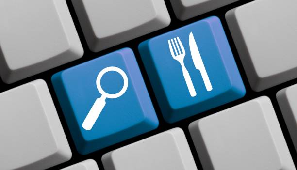 Search for Food and Restaurants online - Computer Keyboard Computer Keyboard with symbols is showing search for Food and Restaurants online restaurant food search stock pictures, royalty-free photos & images