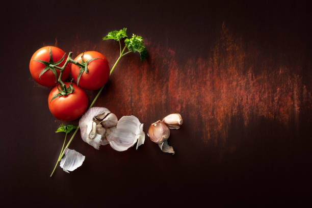 Seasoning: Tomato, Garlic and Parsley Still Life Seasoning: Tomato, Garlic and Parsley Still Life garlic photos stock pictures, royalty-free photos & images