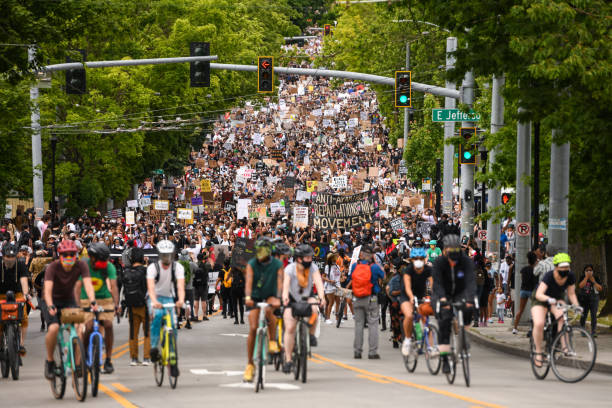 Seattle, USA June 19, 2020: Mid day a huge crowd traveling south on 23rd street just east of downtown for the Juneteenth march.