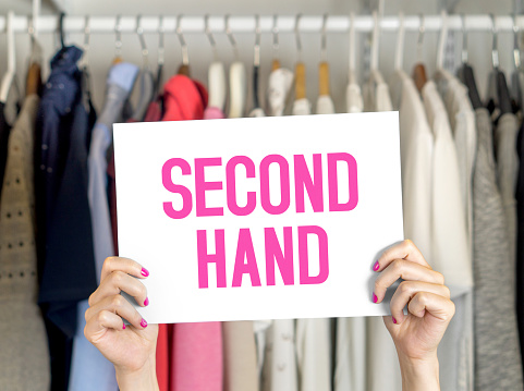 Second Hand Clothing Shop Used Clothes Hanging In Hanger Second Hand Clothing Shop Used Clothes Hanging In Hanger