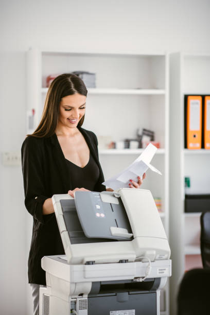 Secretary using printer stock photo