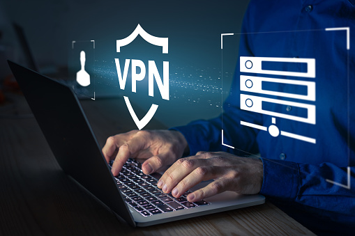 Crop person using vpn server to secure browsing on a laptop