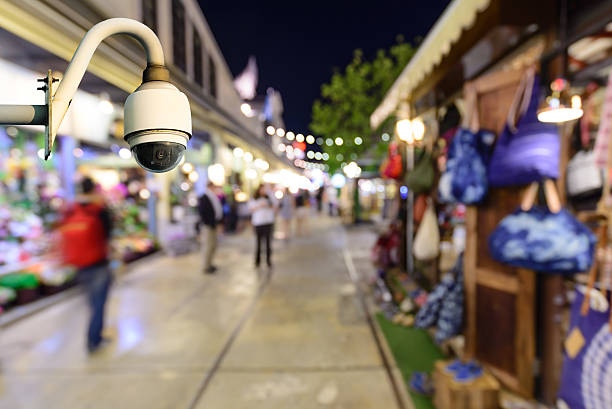 Security camera monitoring events in shopping center at night. stock photo