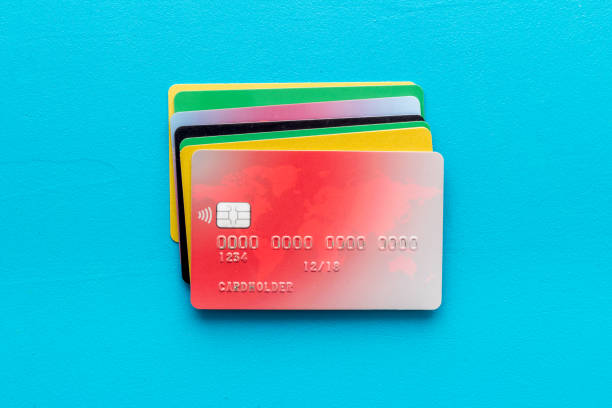 security concept. stack of credit card on blue desk top-down security concept. stack of credit card on blue desk top-down. pile of credit cards stock pictures, royalty-free photos & images