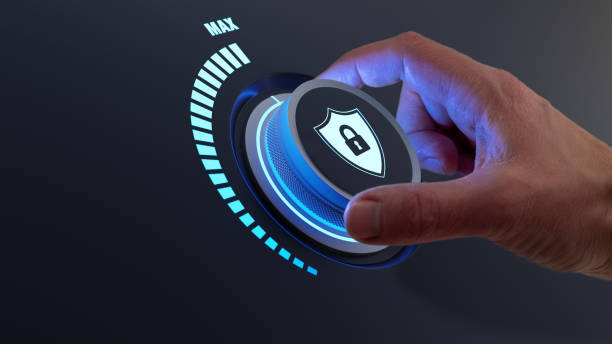 Security concept with person increasing the protection level by turning a knob. Selecting highest defence against cyber attack. Digital crime and data privacy on internet. Cybersecurity. stock photo