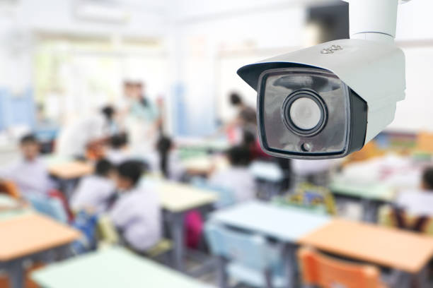 CCTV Security monitoring student in classroom at school.Security camera surveillance for watching and protect group of children while studying. stock photo