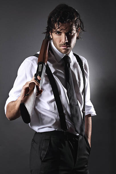 Seductive gangster with shotgun stock photo