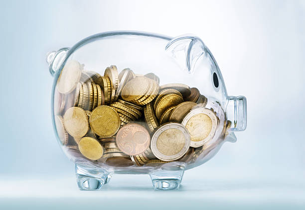 Seeing through piggy bank A see through piggy bank with money coinsSeeing through piggy bank with money coins allowance stock pictures, royalty-free photos & images
