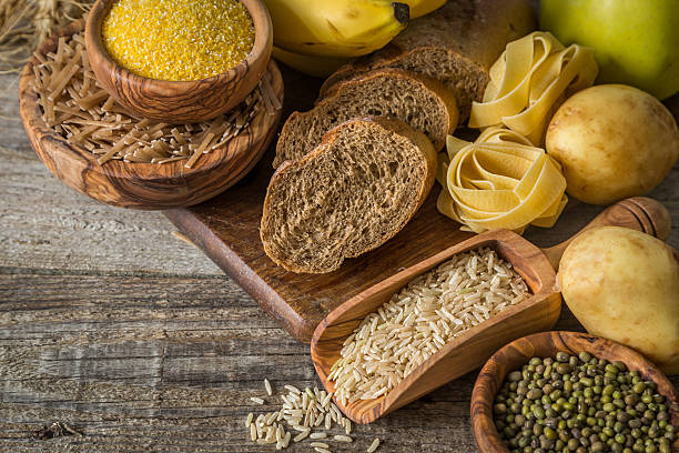 Selection of comptex carbohydrates sources on wood background Selection of comptex carbohydrates sources on wood background, copy space 7 grain bread photos stock pictures, royalty-free photos & images