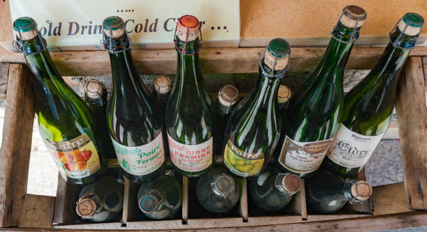 selection of typical Norman apple cider from the Calvados region Honfleur, Calvados / France - 15 August 2019: selection of typical Norman apple cider from the Calvados region calvados stock pictures, royalty-free photos & images