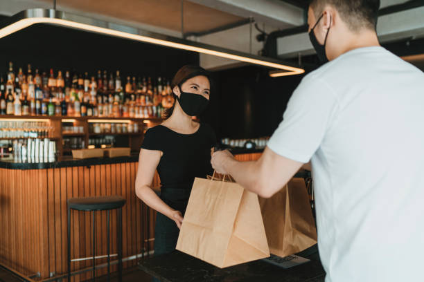 Self collection of take out food without hands contact between staff and customer stock photo